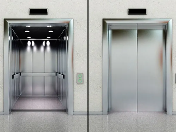 A split image showing two modern, brushed stainless steel flameproof elevator entrances; on the left, the elevator doors are open revealing the interior car, and on the right, the elevator doors are closed, with both featuring a sleek design and digital floor indicators above.